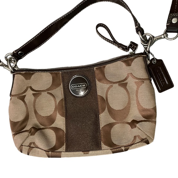 Coach Handbags - Coach signature striped Demi purse. Brown with a brown inside.